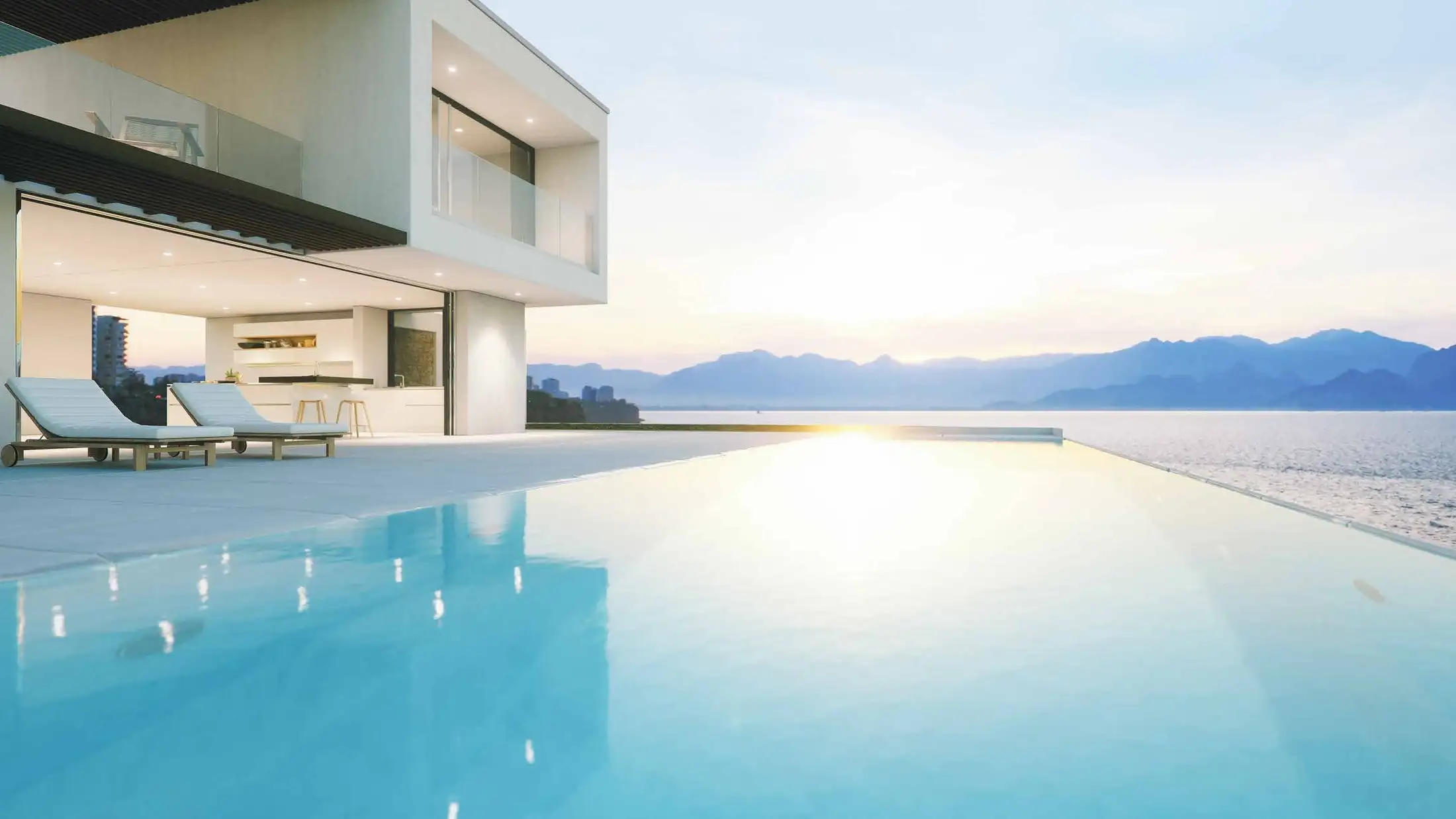 Pompe à chaleur de piscine : bassin chauffé devant une villa contemporaine